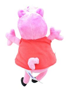 a pink stuffed animal wearing a red shirt