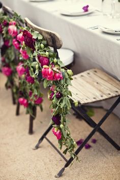 the table is decorated with flowers and greenery