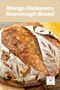 a loaf of mango habanero sourdough bread on a wooden cutting board