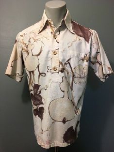 Preowned vtg men’s 1960s 70s Surf Line Hawaii brand off-white cotton linen knit surfer skater hippie beach bum Hawaiian shirt made in USA. Classic retro old school pool party luau 4 wooden button single pocket pullover featuring brown, tan and lavender abstract floral plant pattern and Asian markings reverse print. Light wear, good condition, see pics. Sz medium. Pit-pit 22”. Collar seam down back to bottom edge 27.5”. Back across shoulders 17”. Sleeve 10”. Please compare measurements with an it Vintage Collared Hawaiian Shirt With Relaxed Fit, Vintage Hawaiian Shirt With Relaxed Fit, Fitted Vintage Collared Hawaiian Shirt, Vintage Fitted Collared Hawaiian Shirt, Vintage Brown Top With Camp Collar, Vintage Fitted Top With Camp Collar, Fitted White Vintage Camp Shirt, Brown Collared Top With Vintage Print, White Fitted Vintage Camp Shirt