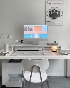 a white desk with a computer on it