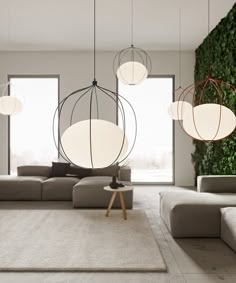 a living room filled with furniture and hanging lights