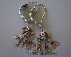 Big vintage ethnic tribal nomad silver earrings with red jewels and dangles. A timeless stunning boho statement, wearable and collectors pieces at the same time. They will never loose their value. Origin: KashmirLength 10,5 cm / 4 1/4 ", Weight 19 g bothThe earwire is with 1.5 mm thicker than modern western earhooks. Therefore these earrings can only be worn through very wide earholes or through a tunnel. For a bigger choice of tribal earrings you may want to visit my Etsy Shop "neemaheTribal":h Red Bohemian Chandelier Earrings Nickel-free, Red Bohemian Nickel-free Chandelier Earrings, Bohemian Red Nickel-free Chandelier Earrings, Red Bohemian Sterling Silver Earrings, Red Bohemian Chandelier Earrings For Pierced Ears, Bohemian Red Chandelier Earrings, Red Bohemian Chandelier Earrings, Red Bohemian Metal Chandelier Earrings, Bohemian Red Metal Chandelier Earrings