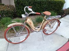 an old bicycle is parked on the sidewalk