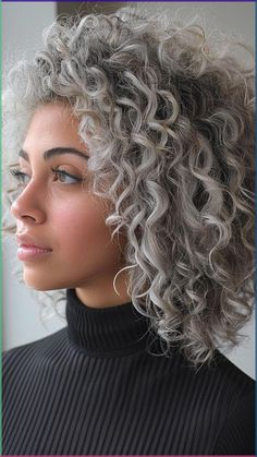 Embrace the enchanting allure of curly silver hair showcased in these 25 trendy styles for a stunning transformation. From tight coils to loose waves, discover how silver hues beautifully complement curly textures for a truly mesmerizing look. Click to explore more #CurlySilverHair inspiration and follow us for daily hair trends! #HairColor #TrendyStyles #HairGoals #SilverHair #HairInspiration Grey Balayage Curly Hair, Grey Permed Hair, Grey Hair Ideas Going Gray, Curly Hair Silver Highlights, Salt And Pepper Curly Hair, Gray Curly Hair Natural Curls, Short Curly Grey Hair, Curly Grey Hair Natural Curls, Wavy Silver Hair