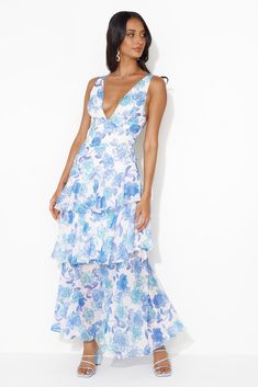 Blue Tiered Midi Dress With Floral Print, Formal Tiered Summer Midi Dress, Formal Tiered Midi Dress For Summer, Spring Tiered Lined Maxi Dress, Blue Lined Maxi Dress, Summer Formal Maxi Dress With Ruffle Hem, Blue Tiered Floral Print Dress, Long Dress With Ruffle Hem For Garden Party, Blue Long Dress With Ruffles