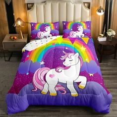 a bed with a purple unicorn on it and rainbows in the sky behind it