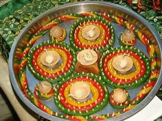 a metal pan filled with lots of food on top of a table