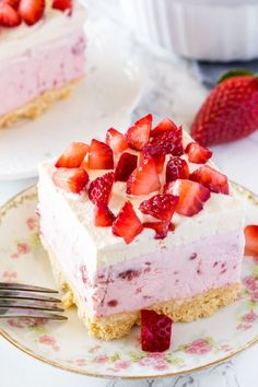 a piece of strawberry cheesecake on a plate with a fork