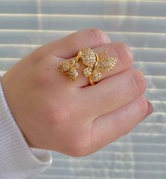 This butterfly ring is a gorgeous cuff or wrap ring. It is made of brass but it is long-lasting gold plated, the ring is open so it allows for the size to be adjustable. Without adjusting the size are about 17.5mm inner diameter and 2.5mm wide the butterfly on the ring is about 10x12x2.5mm and 15x18.5x2.5mm. it comes down to about a size 7 CHECK OUT our Instagram for more pictures & videos of our necklaces plus exclusive coupons- @kaitmariedesignsco ✨💛 Leave us a review & tag us in pict Butterfly Gold Ring Designs, Adjustable Gold Butterfly Open Ring, Adjustable Gold Butterfly Ring For Anniversary, Adjustable Yellow Gold Butterfly Ring, Adjustable Gold Butterfly Ring, Tiffany Nelson, Leave Us A Review, Cool Ear Piercings, Cute Engagement Rings