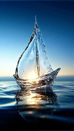 a sailboat floating in the ocean with water splashing on it's side