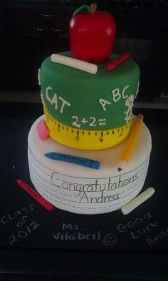 a cake made to look like a scale with a red apple on top and a measuring tape around it