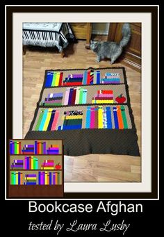 a bookcase afghan is displayed on the floor next to a cat looking at it