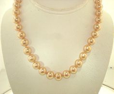 THIS IS A CUSTOM MADE TO ORDER LISTING FOR THIS EXACT LENGTH DESIGN WITH SAME GOLD COLOR PEARLS OR CHOICE OF MANY OTHER PEARL COLORS AVAILABLE THAT WILL TAKE APPROX. 3-5 DAYS TO CREATE BEFORE SHIPPING. AS THESE ARE CUSTOM MADE HERE IN HAWAII, SHORTER OR LONGER LENGTHS ARE ALSO AVAILABLE BY ASKING SELLER FOR A QUOTE. Brand New, Never Used Single-Strand Sea Shell Pearl Necklace. 100% Hand-Made South Sea Golden-Lipped Oyster's Mother of Pearl Shell Single-Strand Pearls Necklace With 14k Yellow Gold-Plated Ring Clasp. - Design: South Sea Shell Pearls (South Sea Gold); Symmetrically Perfect Rounds, 14k Yellow Gold-Plated Ring Clasp, Individually Hand-Knotted Silk Thread Separations, High Polish Luster, Smooth Surface. - Measures: Pearls Average Approx. 9.9mm - 10.1mm Round (Approx. Just Over 3/ Pearl Seashell, Pearl Details, Pearls Necklace, South Seas, South Sea Pearls, Sea Pearls, Pearl Shell, Plated Ring, Gold Plated Rings