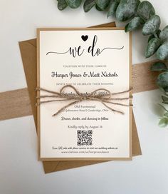 the wedding stationery is tied up with twine