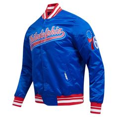 a blue jacket with red and white stripes on the sleeves, featuring an image of philadelphia's baseball team