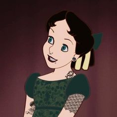 a woman in a green dress with tattoos on her arm