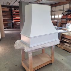 a large white stove top sitting in a room