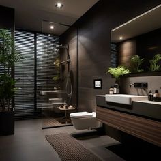 a modern bathroom with black walls and flooring