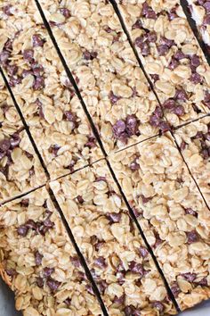 an oatmeal and raisin granola bar is cut into squares on a baking sheet