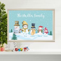 a christmas card with three snowmen in the middle and one is holding a present