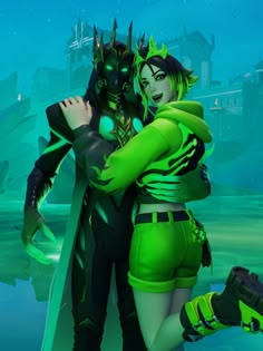 an image of two people dressed up in green and black costumes standing next to each other