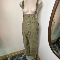 This Vintage Overall Was Issued To The Us Navy Contractor Nxsx38052 And Is In Fantastic Condition. This Would Have Been Used As A Deck Bib On A Warship During Ww2! Lined With Fleece, Adjustable Straps, Original Buttons, No Staining, Stenciled Usn Size Medium Measurements: 42” Waist 49” Hip 22” Rise 29” Inseam All Vintage Clothing In My Shop Has Been Worn Previously - Meaning We’re Just The Middle Man On Trying To Get These Guys New Loving Homes. All Are As-Is And By Purchasing From Us You Agree To This. Green Workwear Overalls, Green Overalls For Work, Utility Style Overalls With Belt Loops, Utility Overalls With Belt Loops, Overall Pants, Middle Man, Bib Overalls, Vintage Pants, Us Navy