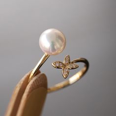 Akoya Pearl Rose Gold Butterfly Ring, Japan Pearl And Diamond Ring, Vintage Real Pearl Ring, Ivory Pearl, Pinkish Pearl, Dainty Promise Ring ✦PRODUCT DETAILS✦ → Main stone: Akoya Pearl 7.5-8.0mm → Side stone: Diamond 0.026ct ✦SPECIFICATIONS✦ MOISSANITE ✓ COLOR: D ✓ CLARITY: VVS1 ✓ CUT: EXCELLENT OR DIAMOND ✓ COLOR: F-G ✓ CLARITY: SI1-VS ABOUT US ♥ Our designer and craftsmen work to create and deliver the most refined pieces of jewelry to you. We carefully handpicked and sourced each gemstone to Elegant Flower-shaped Pearl Ring For Weddings, Elegant White Flower-shaped Pearl Ring, Dainty Promise Ring, Pink Diamonds Engagement, Gold Butterfly Ring, Heart Shaped Diamond Ring, Pink Diamond Engagement Ring, Diamond Ring Vintage, Argyle Pink Diamonds