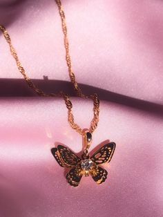 ✨ITEM DETAILS✨The sweetest butterfly necklace featuring a cute cubic zircon diamond. 18K Gold plated. You can pair it with our matching Mariposa hoops! ✧Chain length: 45 cm waterwave chain✧Pendant size: 2cm*1.3cm✧18K Gold plated pendant✧Gold filled chain✧Lead and Nickel free✨SHIPPING✨✧ UNITED STATES: Free Tracked Shipping✧ CANADA:  Free Untracked Shipping. You can upgrade to tracking                        at checkout.✧ INTERNATIONAL: $8.50 Tracked shipping Gold Plated Butterfly Necklace With Charm, Dainty Gold-plated Butterfly Jewelry, Gold Plated Butterfly Necklace For Gift, Dainty Gold-plated Butterfly Necklace, Dainty Gold Plated Butterfly Jewelry, Gold Plated Butterfly Charm Pendant Necklace, Gold Plated Butterfly Charm Jewelry, Gold-plated Butterfly Jewelry With Delicate Chain, Gold Plated Butterfly Necklace With Delicate Chain