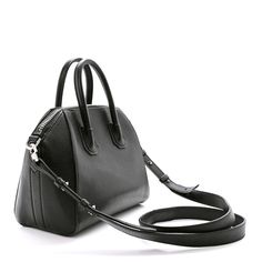 This is an authentic GIVENCHY Sugar Goatskin Mini Antigona in Black. This elegant mini tote is crafted of textured goatskin leather in black. It features rolled top handles, an optional shoulder strap, and silver hardware. The top zipper opens to a beige fabric interior with zipper and patch pockets. Mini Antigona, Pandora Black, Pop Stitch, Mini Studs, Chain Crossbody Bag, Beige Fabric, Mini Tote, Wallet Chain, Black Cross Body Bag