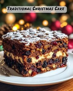 a piece of christmas cake on a plate with the words traditional christmas cake above it