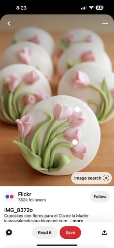 some white and pink flowers are in the shape of eggs on a wooden table with an instagram message below