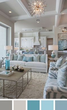 a living room filled with furniture and a chandelier