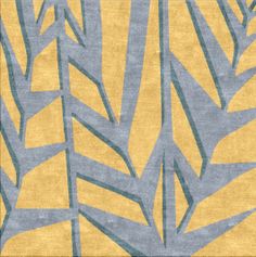 a yellow and blue rug with leaves on it