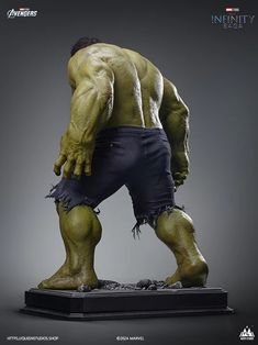 the incredible hulk statue is displayed in front of a gray background with an inscription that reads,