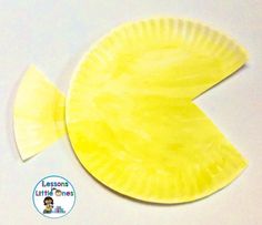 a paper plate shaped like a yellow fish