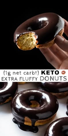 a hand holding a chocolate covered doughnut in front of other donuts with the words, 1g net carb keto extra fluffy donuts