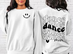 Dance Mom Sweatshirt, Dance Lover Sweatshirt, Dancer Sweatshirt,Cute Sweatshirt,Senior Dance Mom, Trendy Sweatshirt, Retro Smile Dance Mom Sweatshirt Hi! Welcome to✨Northstar ✨ ✨As the weather gets colder, you want clothes that keep you and your body warm. Here, Northstar  is ready to keep you warm with its unique designs..✨ ✨Product Features✨ 👉Medium-heavy fabric (8.0 oz/yd² (271.25 g/m 👉Loose fit 👉Runs true to size 👉50% cotton, 50% polyester 👉Tear-away label ✨Care Instructions✨ 👉Wash ite Casual White Top For Dance, White Casual Tops For Dance, White Casual Dance Top, Relaxed Fit Crew Neck Top For Dance, Hip Hop Crew Neck Top For Dance, Hip Hop Style Crew Neck Top For Dance, White Graphic Print Top For Dance Class, Crew Neck Casual Top For Dance Class, White Relaxed Fit Top For Dance Class