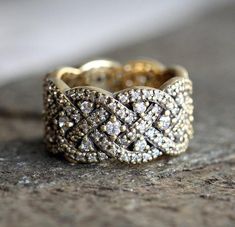 a diamond ring sitting on top of a rock