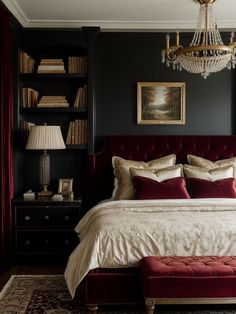 a bedroom with black walls and red velvet bedding