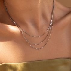 Designed for easy pairing and effortless style, the Box Chain Necklace Set is the perfect complement to your favorite wardrobe staples. This set features not just one, but three delicately layered necklaces, perfect for everyday wear and beyond. Material: High Quality Solid 925 Sterling Silver Finish: 18K Gold ∙ Sterling Silver Featuring a layered necklace set of 3 Box Chains - Shortest Chain: 14in -- Middle Chain: 16in -- Longest Chain: 17in, adjustable with a 2 inch extension Part of our Golde Sterling Silver Chain Necklace For Layering, Snake Chain Necklace With Double Chain For Layering, Double Chain Snake Necklace For Layering, Dainty Silver Snake Chain Necklace With Delicate Chain, Dainty Silver Snake Chain Necklace With Delicate Details, Everyday Layered Silver Chain Necklace, Silver Snake Chain Layered Necklace As Gift, Silver Snake Chain Layered Necklace For Gift, Aquamarine Stacking Ring