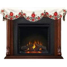 a fireplace with a christmas mantle and fire place cover on it's mantle, decorated with poinsettis