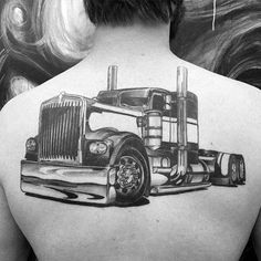 the back of a woman's neck with a drawing of a truck on it