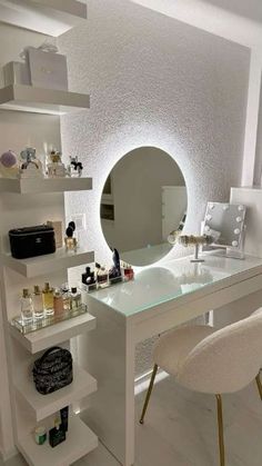 a white desk topped with a mirror and lots of bottles