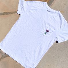 Embroidered lavender bouquet tshirt. All products machine washable! Summer Cotton Tops With Embroidered Logo, Summer Cotton Top With Embroidered Logo, White Casual Tops With Custom Embroidery, White Short Sleeve T-shirt With Floral Embroidery, White Floral Embroidered T-shirt, White Casual Top With Custom Embroidery, Casual Cotton Tops With Floral Embroidery, White Floral Embroidery Short Sleeve T-shirt, White Floral Embroidered Short Sleeve T-shirt