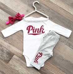 What little princess doesn't need a hot pink Love Pink inspired outfit?!? ATTENTION: Pants styles WILL vary based on what's available. Thank you for your understanding. :) Outfits available in size Newborn to 5T!! The Top Beautifully embellished with glittery hot pink designs to create the most adorable look. Sizes Newborn-24 months will be made on a 100% Carters brand baby soft cotton bodysuit available in long or short sleeves. 2T-5T come as a short sleeve T-Shirt featuring elegant scalloping