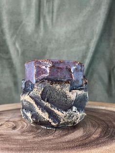 a piece of wood sitting on top of a wooden table