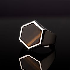 This stunning ring is handcrafted with the highest attention to detail and sparkles with radiant beauty. The Hexagon Cut gemstones - Turquoise, Tiger's Eye, Onyx, and Red Garnet - are perfectly set in a sterling silver band with intricate detailing, creating an opulent and elegant piece of jewelry that you will treasure for years to come. The bold design of this ring will make it the standout of any outfit, complementing your look and expressing your own unique style. The vibrant contrast betwee Modern Jewelry With Stone Setting, Luxury Octagon Faceted Ring, Formal Silver Hexagon Rings, Modern Octagon Signet Ring For Gift, Modern Octagon Signet Ring As Gift, Modern Octagon Shaped Signet Ring As A Gift, Modern Octagon Signet Ring, Modern Octagon-shaped Signet Ring Gift, Modern Jewelry With Large Stone Open Ring