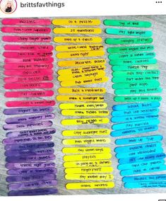 the words are written in different colors and sizes on popsticks with writing underneath them