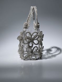 This chic Chrysanthemum Crystal Flower Bag In Silver is crafted from sparkling crystal and features an elegant shoulder strap. Perfect for a special occasion, this bag adds a touch of sophistication to any outfit.    Material: PVC   Crystal shoulder straps Nails Necklace, Unique Handbag, Flower Bag, Red Carpet Event, Wedding Bag, Feather Dress, Elegant Party, Crystal Flower, Chic Accessories